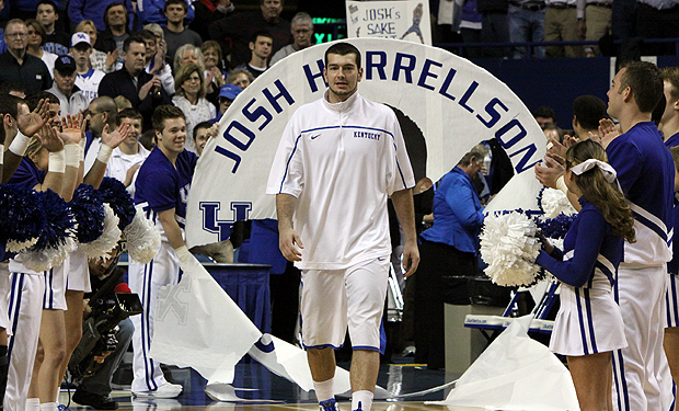 University of Kentucky forward Josh Harrellson is congratulated by a  News Photo - Getty Images